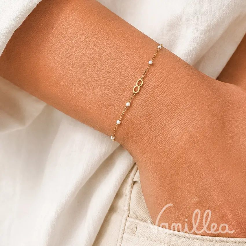 bracelet infinity doré perles blanches acier inoxydable vue face