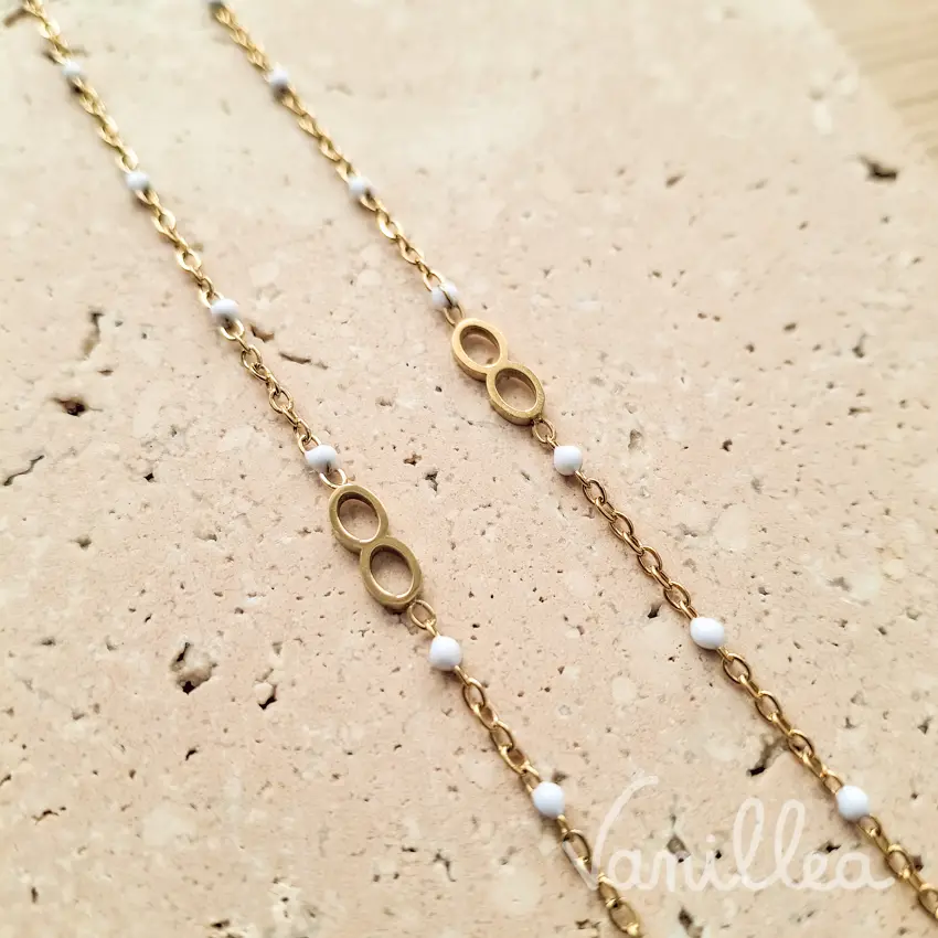 bracelet infini femme doré avec perles blanches