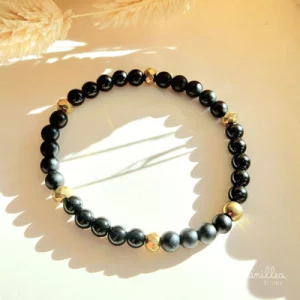 Bracelet noir en pierres naturelles d'onyx et d'ématite dorée