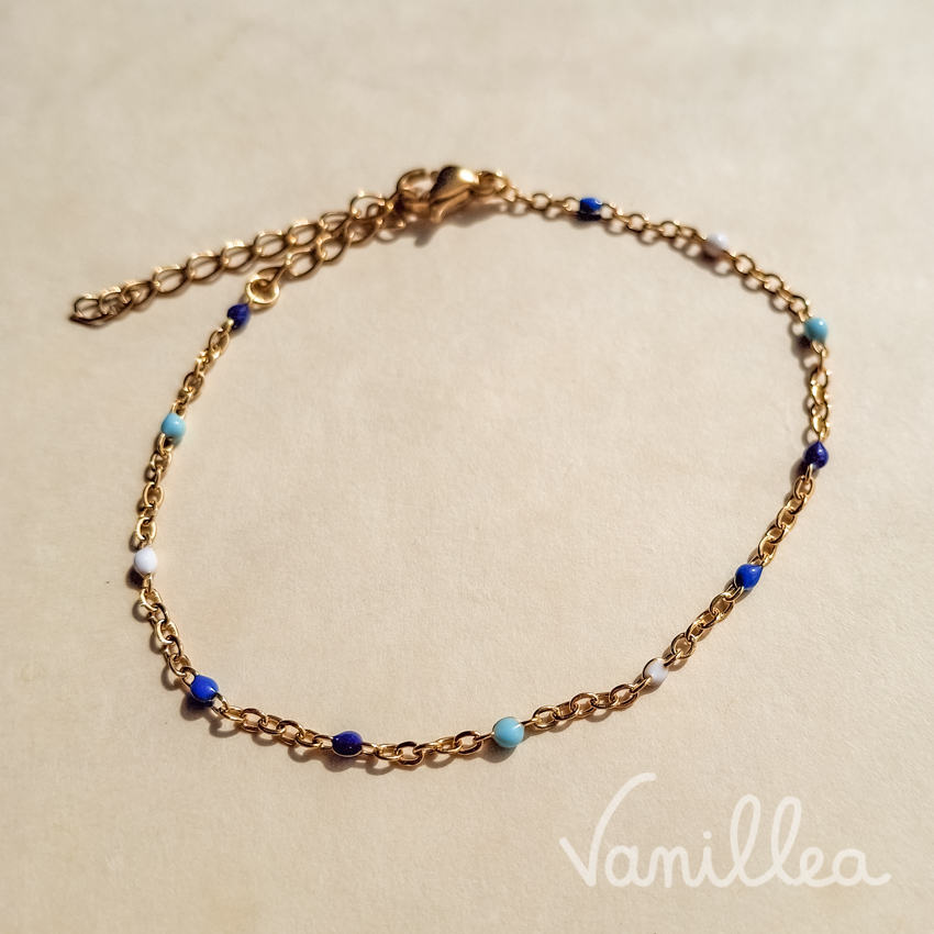 bracelet perles bleues acier inoxydable doré détail chaßne fine